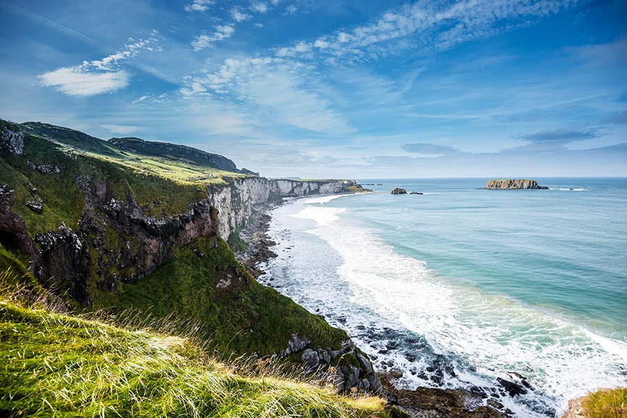 Dramatic cliffs along the Antrim Coast Road overlooking the Atlantic Ocean in Northern Ireland