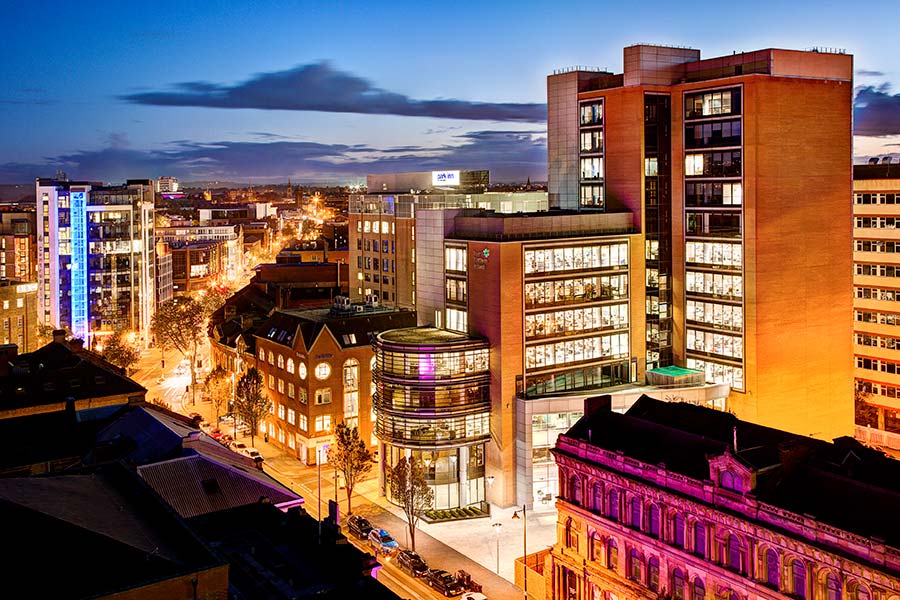 Belfast city skyline Northern Ireland night view illuminated streets and buildings