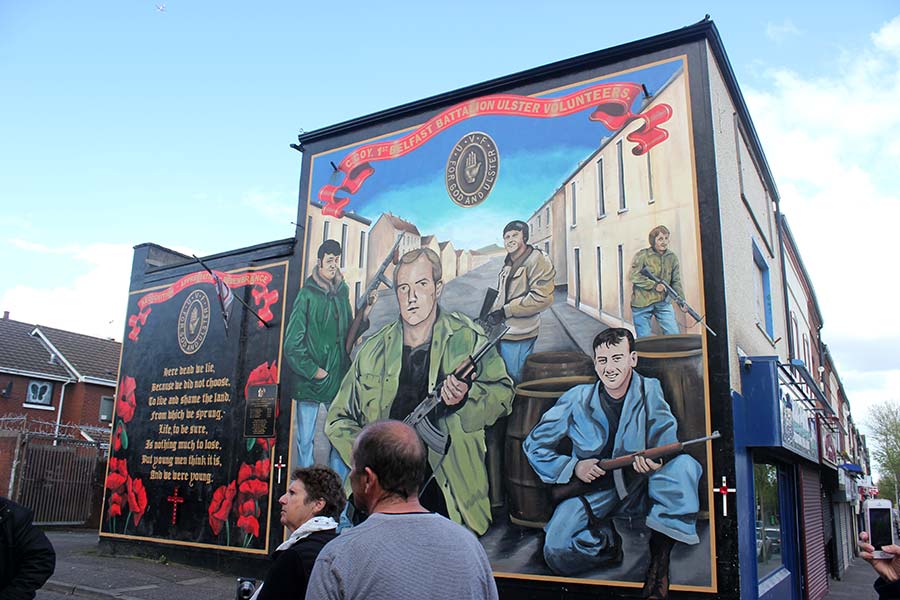 Political mural on Shankill Road Belfast showing loyalist figures and scenes from the Troubles